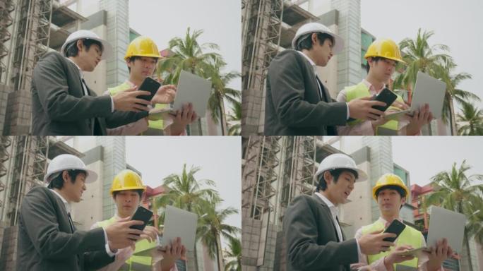 戴着帽子的工程师专心地向持有计划表的工人下达工作命令。