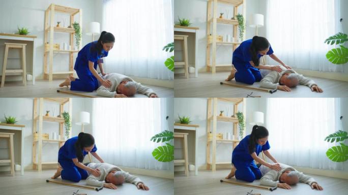 亚洲护理人员帮助老年男性在家中摔倒。老年老年患者在做物理治疗后发生事故，然后由客厅有吸引力的治疗师护