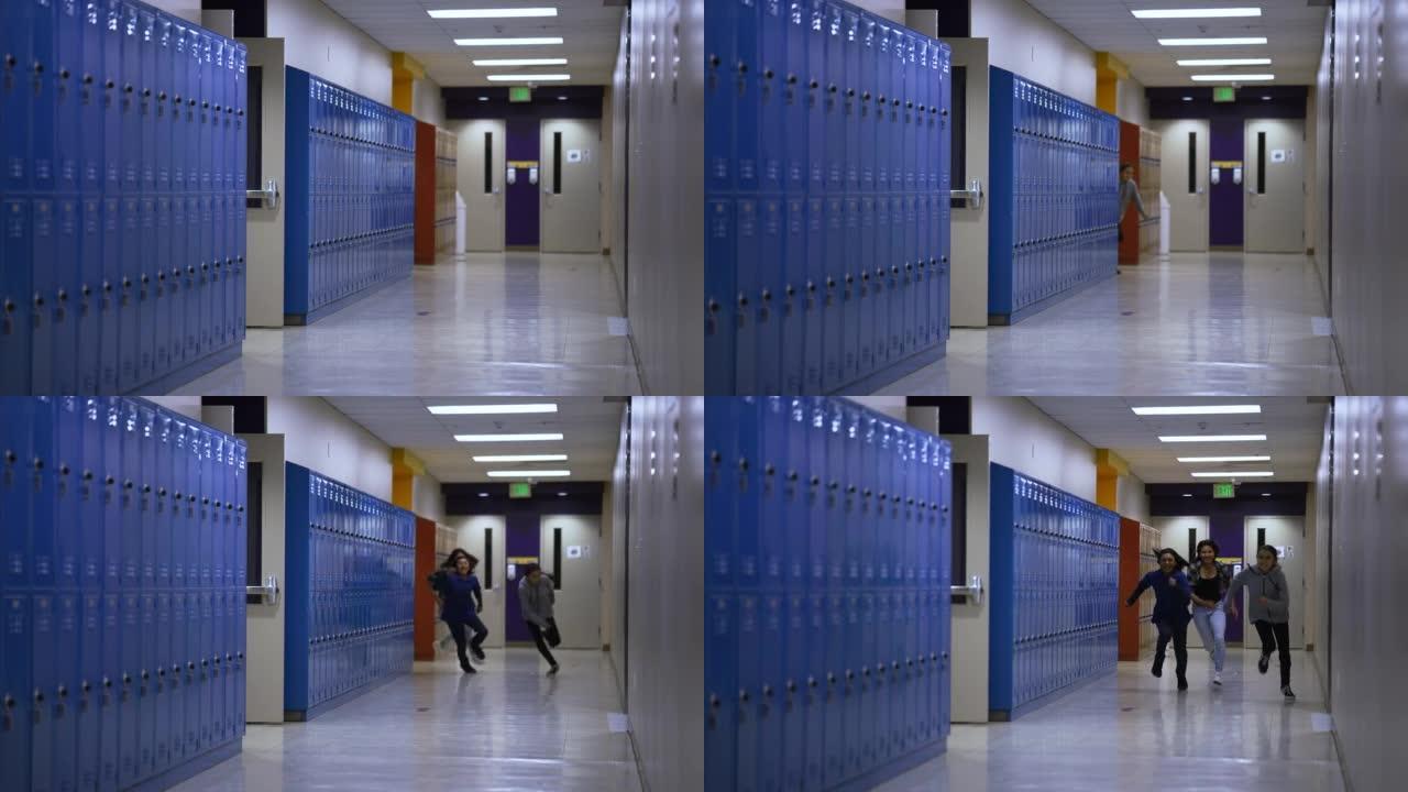 三个初高中孩子在学校走廊里快速奔跑