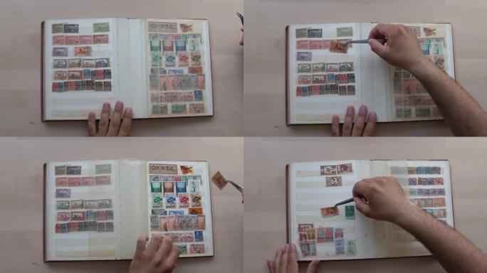 成年男子双手慢慢地将邮票插入相册。
