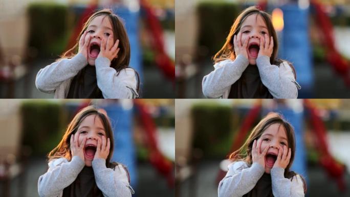 儿童休克对相机的情感反应可爱的女孩尖叫着惊讶