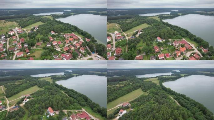 波兰村壮观美丽的湖泊鸟瞰图。欧洲有树林和湖泊的乡村。大湖和绿色森林的戏剧性鸟瞰图。史诗般的惊人的自然
