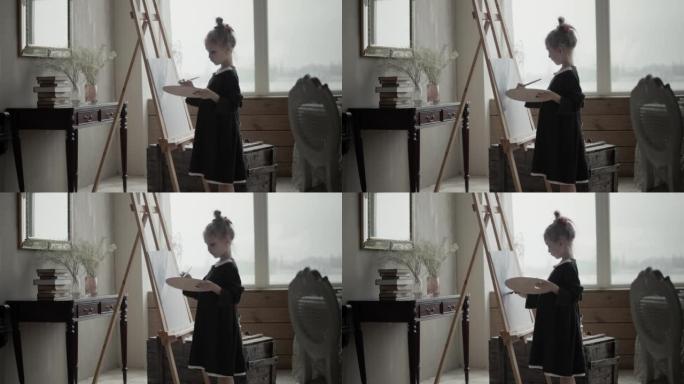 小女孩艺术家用画笔绘画