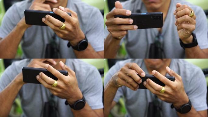 使用智能手机在线交流的男人的手的特写镜头。