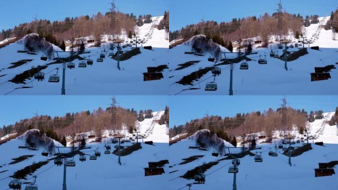 滑雪缆车在奥地利阿尔卑斯山的雪域景观上移动。