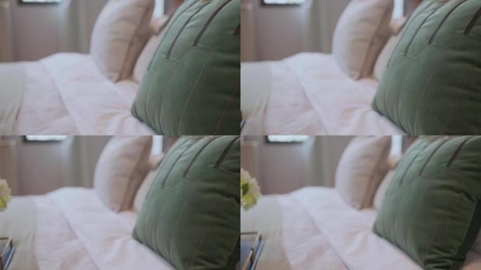 卧室室内设计多莉拍摄，家居室内概念软枕头布置在特大白色毯子床垫卧室与白色窗帘背景家居甜蜜家居室内创意