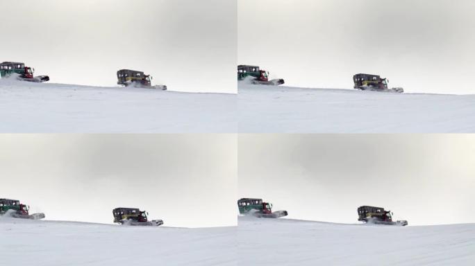雪猫ratrack用扫雪机准备滑雪场，驶过滑雪胜地的深雪道。重型机械山地设备