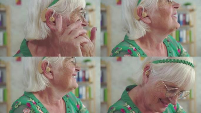 戴着眼镜退休的幸福女人戴上助听器