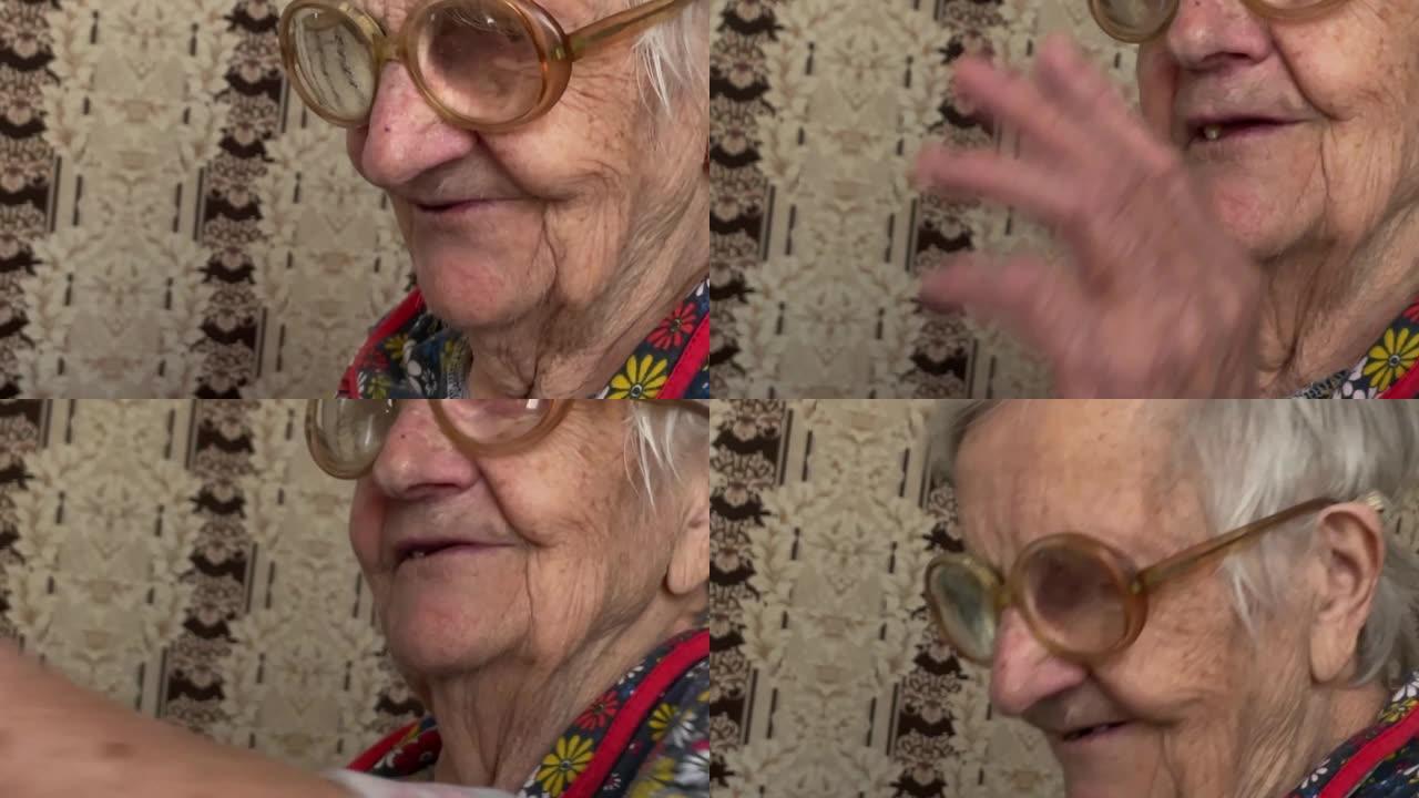 一位90岁的白发老妇正坐在家里与某人交谈。