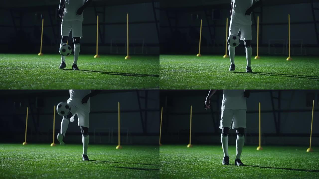 黑人足球运动员用脚踢球，在体育馆训练，运动员腿部特写镜头