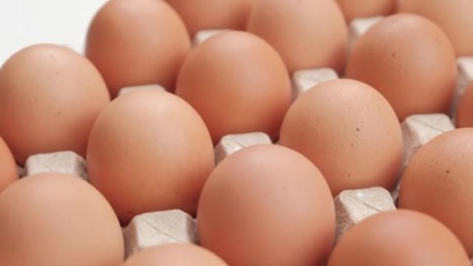 鸡蛋，旋转射击，纸箱包装的鸡蛋，鸡蛋生产概念。