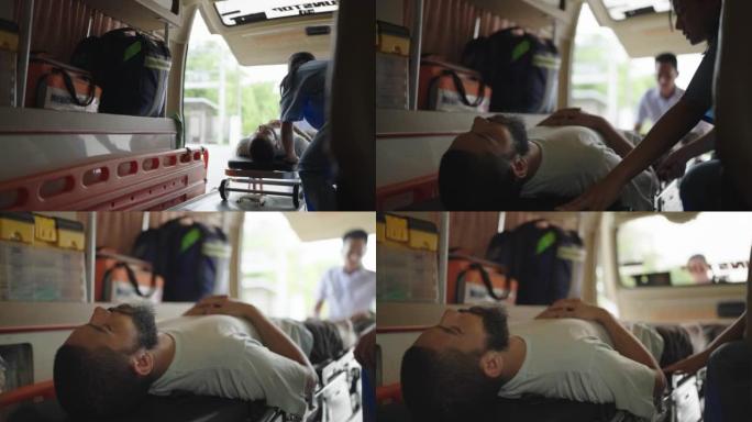 病人被紧急医疗队送入救护车接受治疗。