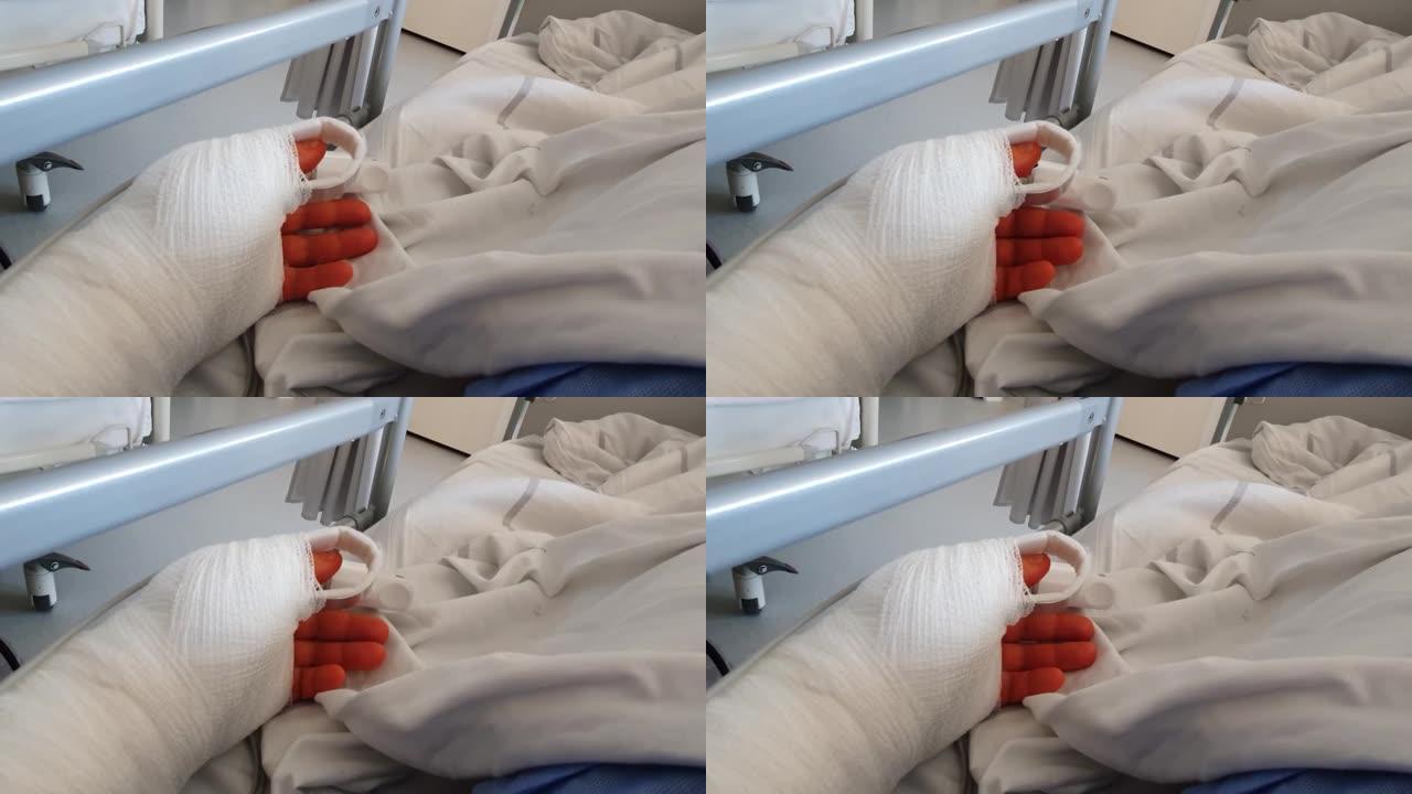 手部手术后在医院病床上的男子