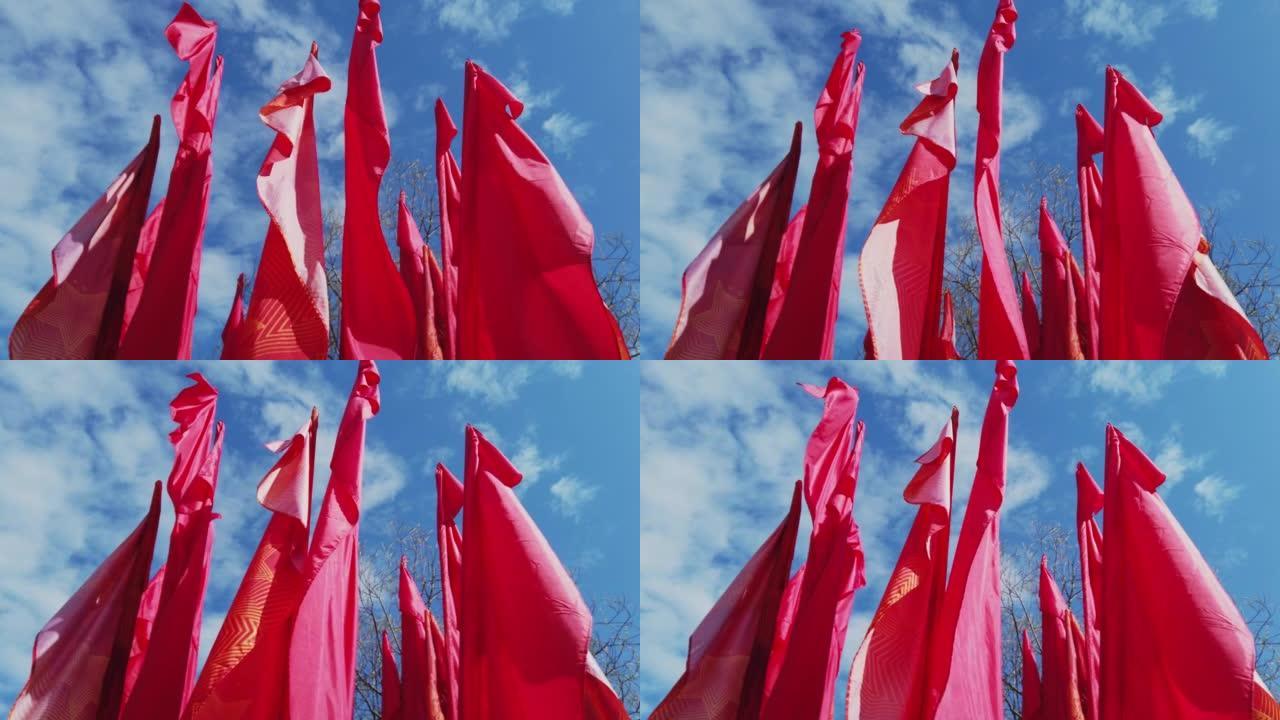 胜利日假期，喜庆的红旗在蓝天上。