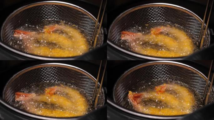 在油炸锅中烹饪天妇罗虾
