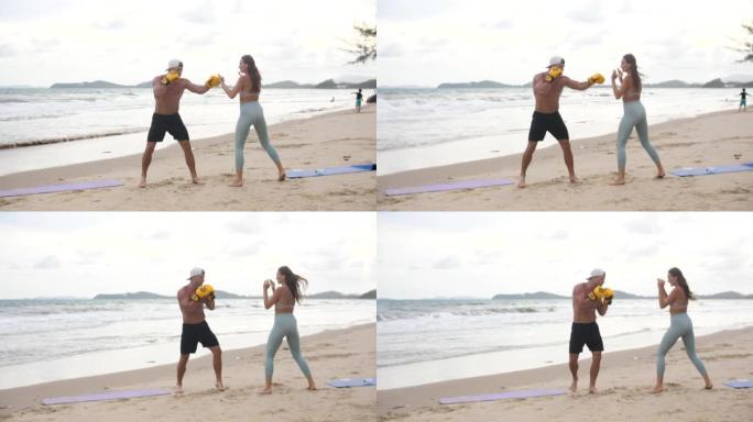 拳击教练在海滩上教女子武术