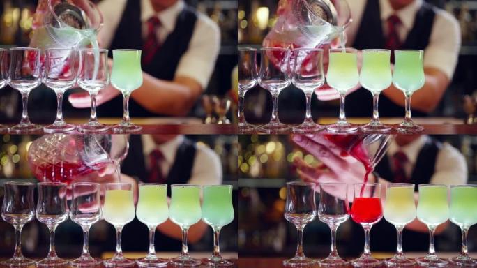 4k男调酒师在夜总会的酒吧柜台为顾客准备彩色鸡尾酒饮料。