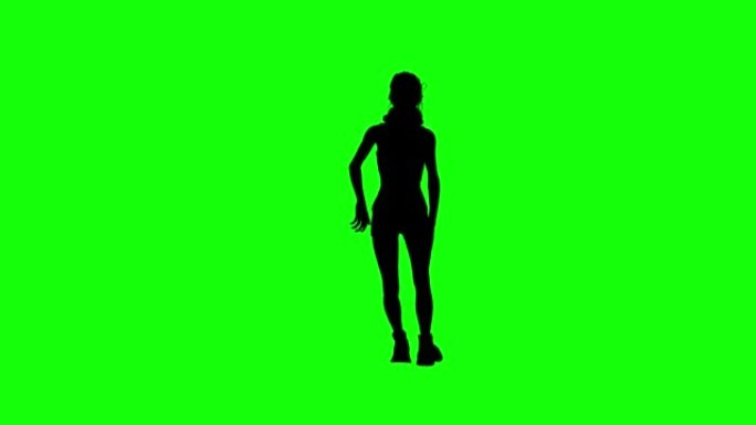 女孩剪影在绿色屏幕上跳舞