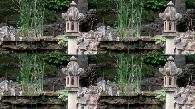 日本古色古香的花园石灯和花园中流有草的水