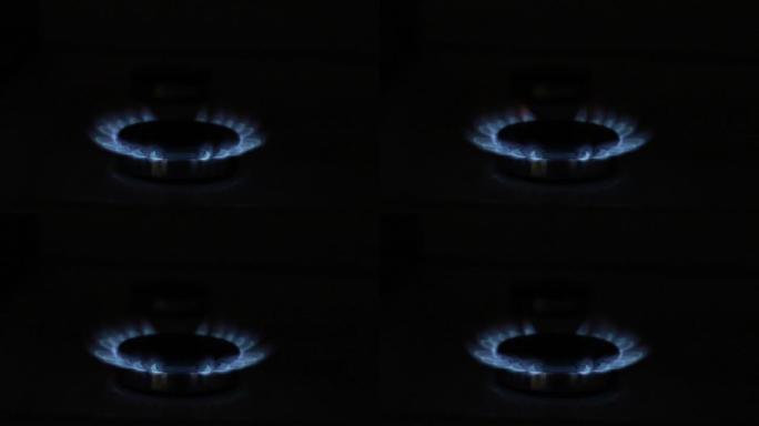 煤气在煤气炉上燃烧蓝色。天然气资源。供暖季节