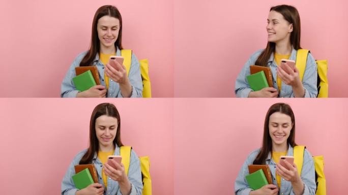 可爱的女孩肖像青少年学生穿衬衫和黄色背包拿着书籍使用手机在工作区复制空间模拟，孤立在工作室的粉色背景