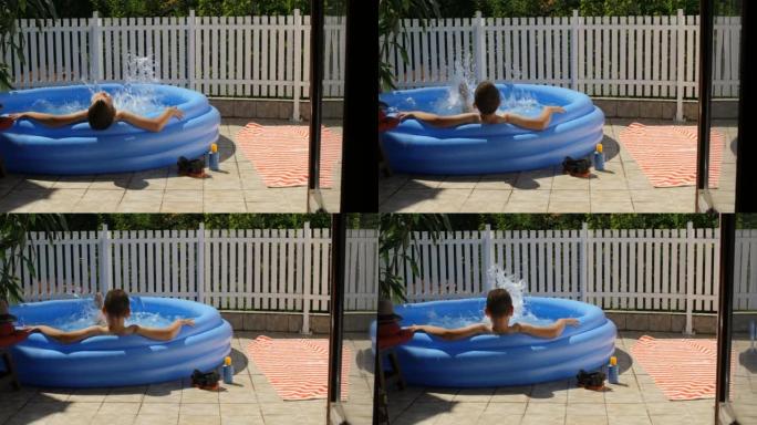 夏天的概念，快乐的男孩在外面的游泳池里玩得开心