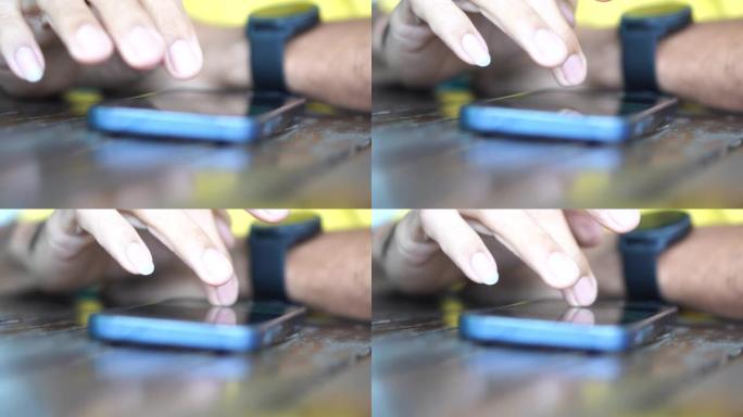 近镜头在手男子用智能手机上网上网网购