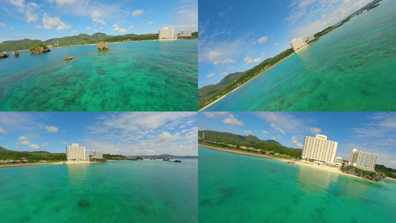 日本冲绳海滩飞越岩石和珊瑚礁的无人机镜头