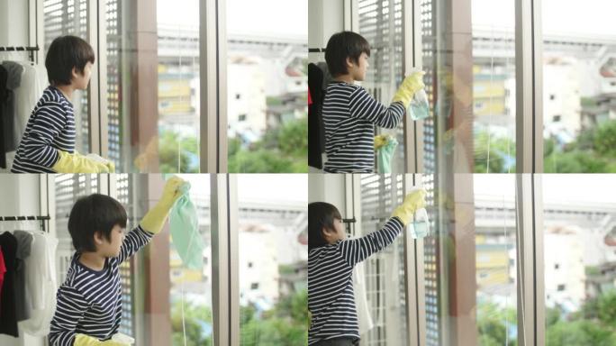 儿童清洗和擦拭房屋的玻璃窗