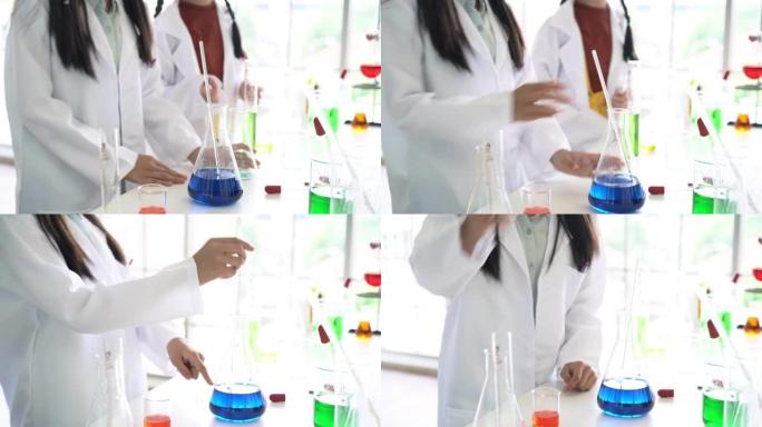 童年的学生和朋友在教室实验室学习科学