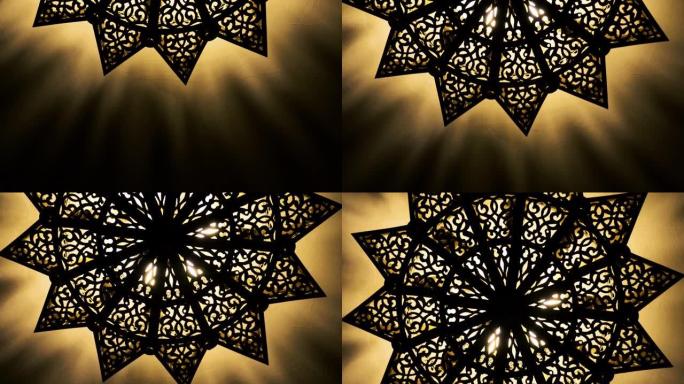 摩洛哥阿拉伯黄铜灯以复杂的图案点亮。奢华的生活方式，室内背景镜头。
