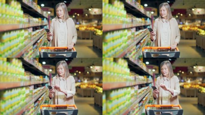 买手客户用智能手机查看购物清单，在超市杂货店购买。