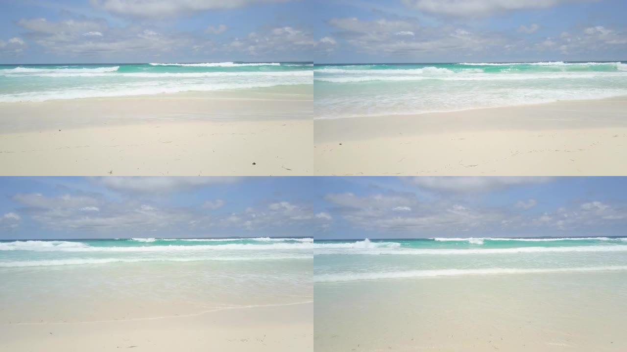 加勒比海。海浪席卷加勒比海白色沙滩的轻松镜头。白沙，清澈的水和汹涌的海浪