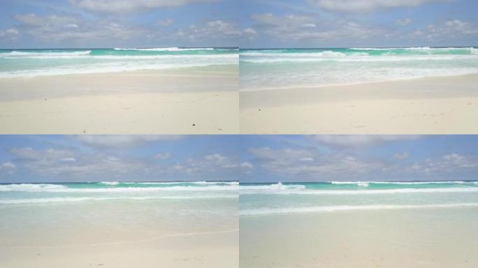 加勒比海。海浪席卷加勒比海白色沙滩的轻松镜头。白沙，清澈的水和汹涌的海浪