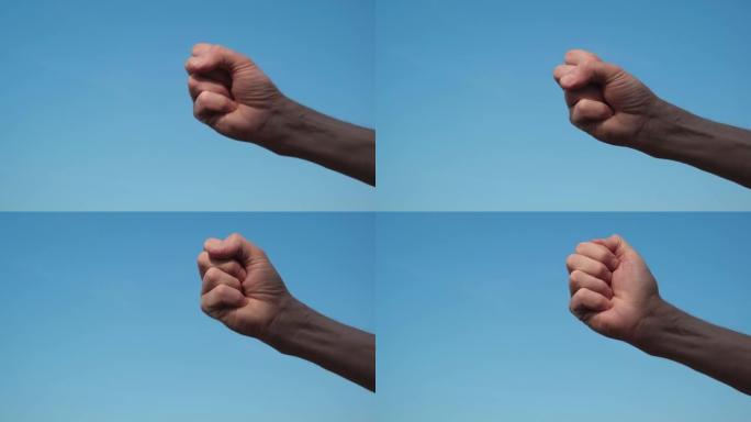 一只手从手掌侧的特写镜头，手指从零数到五。慢动作。