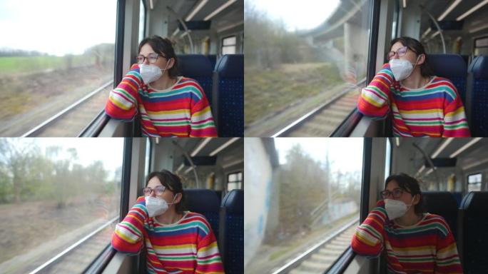 新型冠状病毒肺炎大流行期间戴口罩的女人在火车上旅行