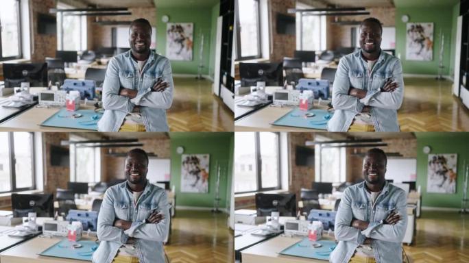 年轻开朗的随随便便的商人在办公室摆姿势