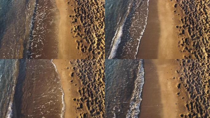 无人机鸟瞰图海洋-沙滩和海浪冲向西班牙穆尔西亚海岸线的海岸