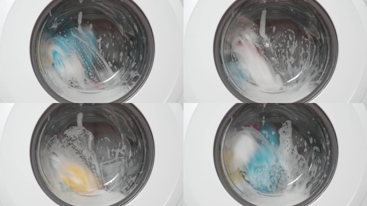 工作洗衣机，带门和洗衣粉泡沫的前视图，视频4k分辨率