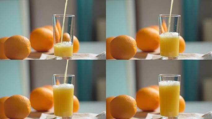 橙汁正在倒入玻璃杯中。健康的素食。维生素食品。成熟的橘子。