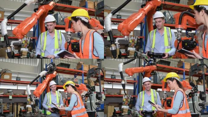 男女工程师检查最近安装的焊接机器人，以实现完整，准确，快速和高度安全的工作。