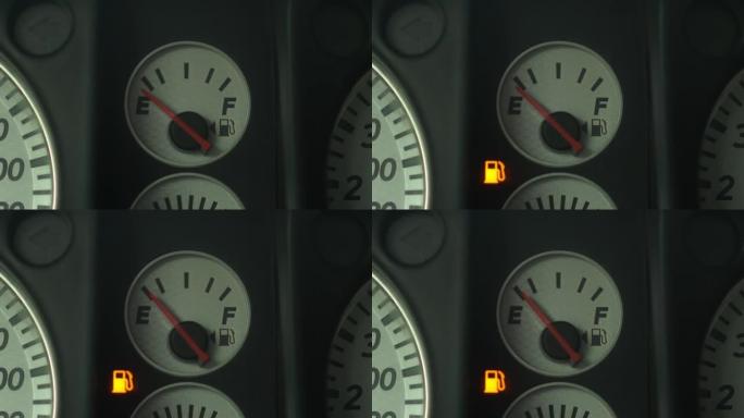 车内燃油表低，警告灯亮。特写。