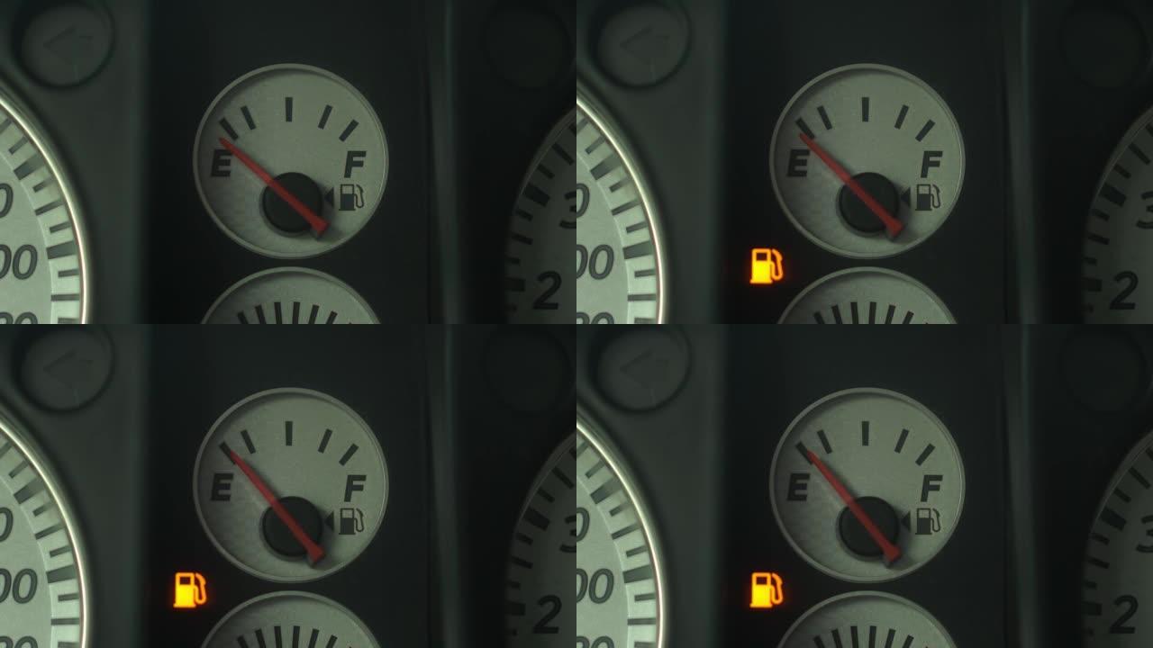 车内燃油表低，警告灯亮。特写。