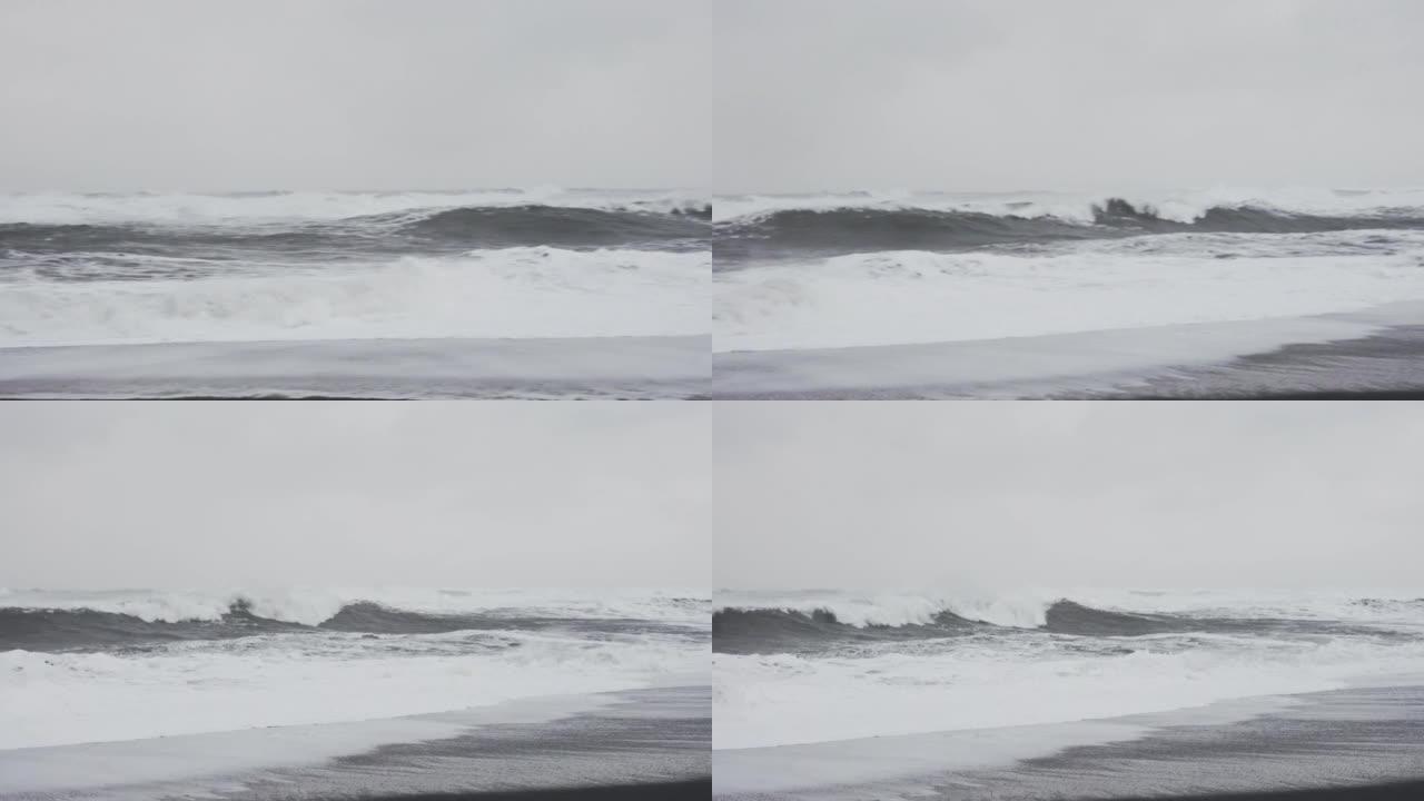 暴风雨般的白浪来到黑沙滩