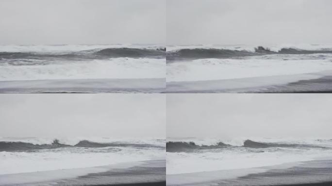 暴风雨般的白浪来到黑沙滩