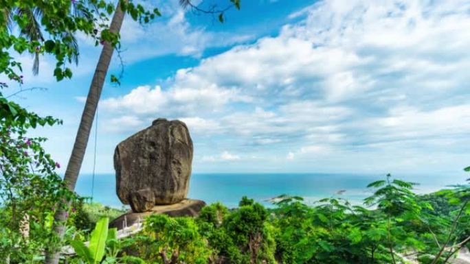 旅行者在泰国苏梅岛的蓝天森林中漫步风景秀丽的石头，重叠的石头