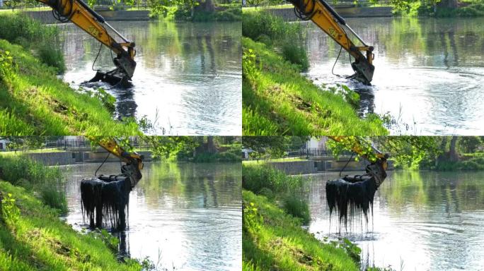 工业重型挖掘机挖泥河底清除淤泥泥和海藻