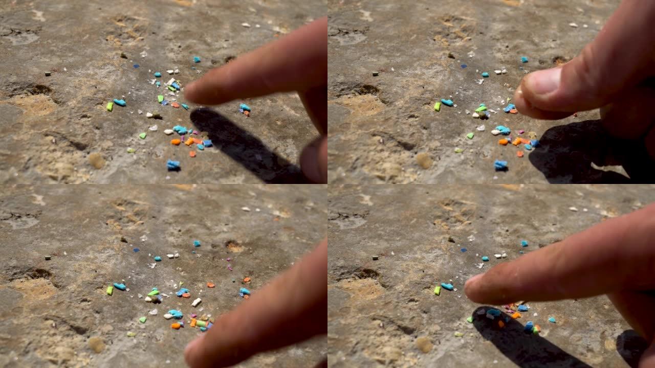 微塑料颗粒的特写镜头。水污染和全球变暖的概念。