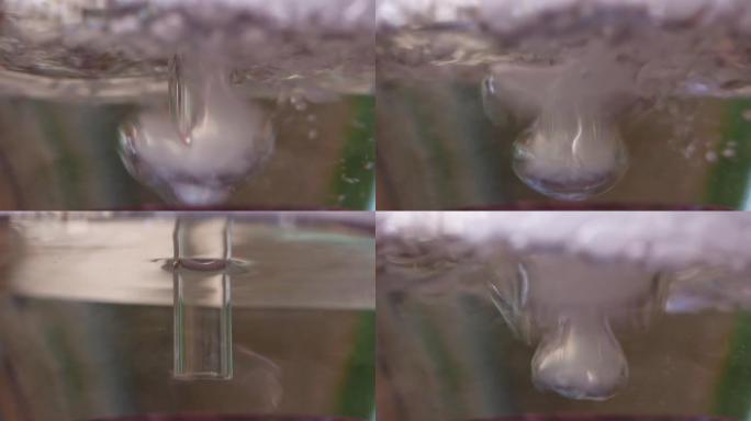 用玻璃瓶抽水烟的镜头特写。