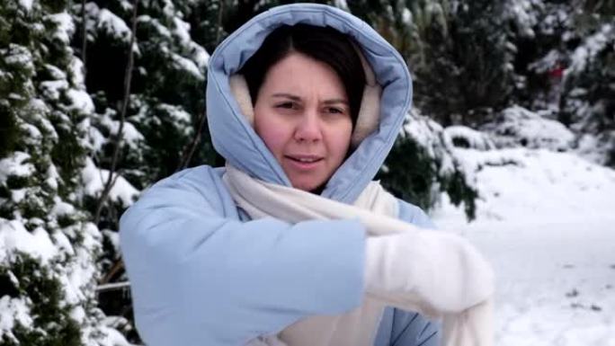 时髦的女人在冬天下雪的日子会变冷